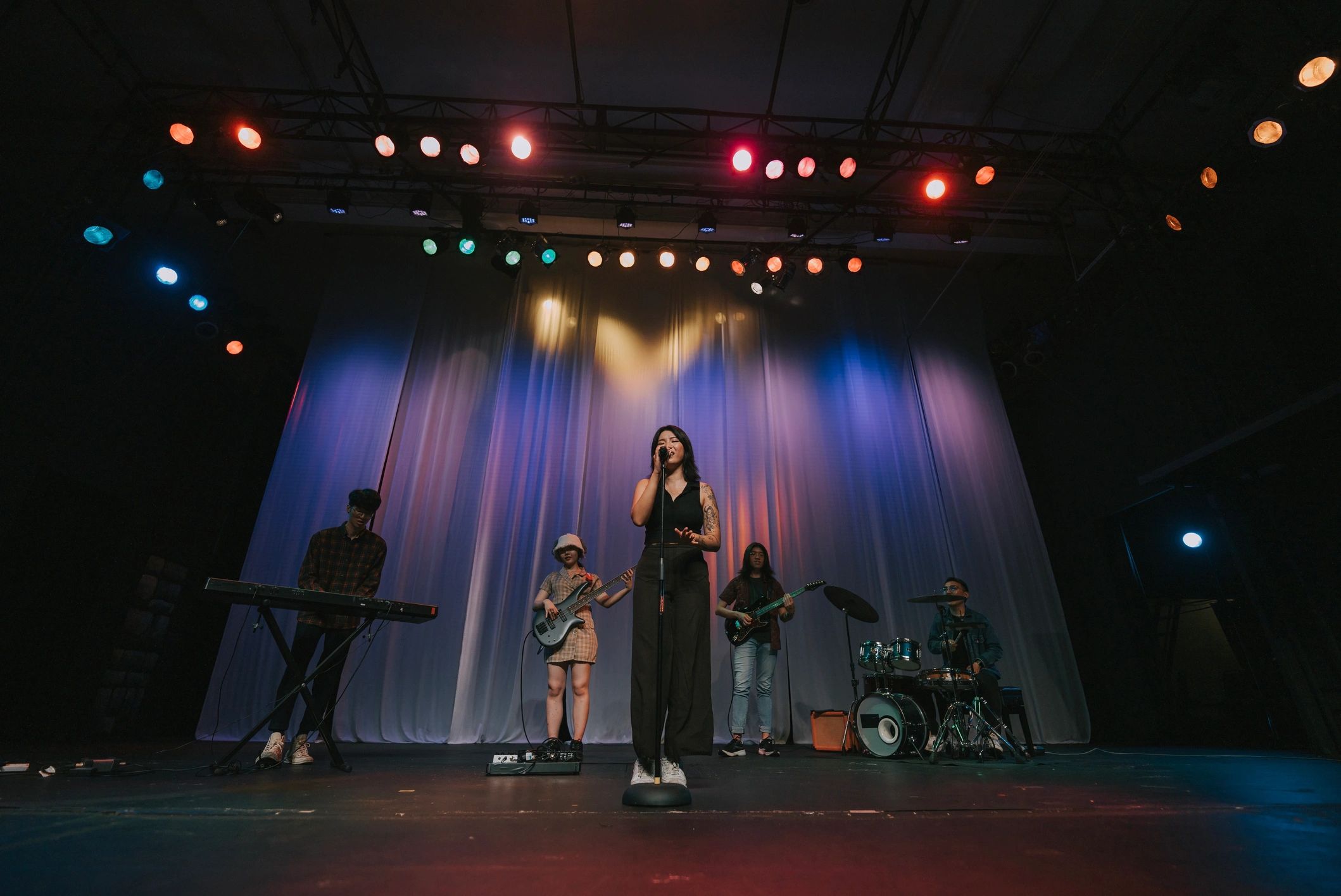 Crowd enjoying a live music performance in a downtown festival setting